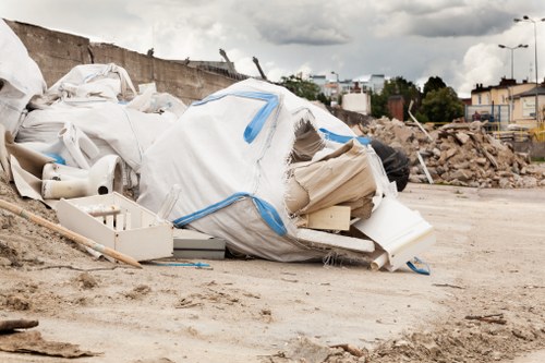Operatives loading household waste during a clearance job