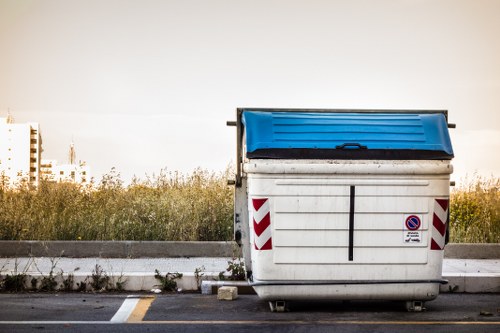 Recycled materials separated into different containers at a clearance site